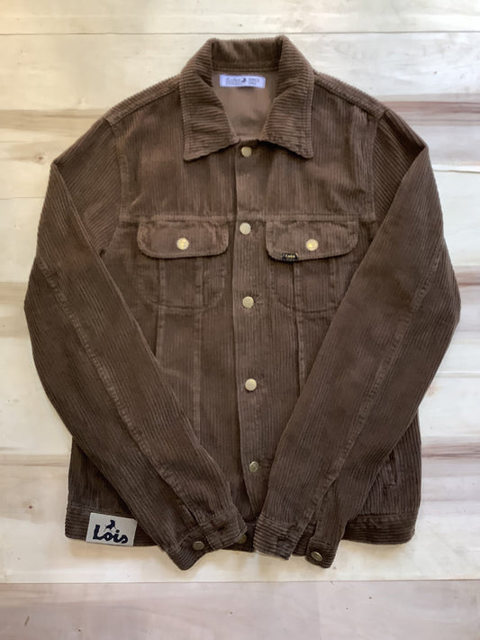 Brown jacket with button details on a wooden surface
